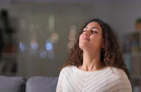 A resident enjoying the air in their home with peace of mind after an air quality inspection